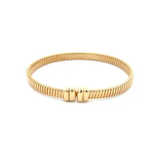 Gold ribbed bracelet with central clasp