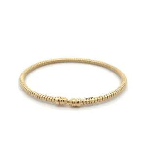 Gold coil bracelet with rounded clasp ends