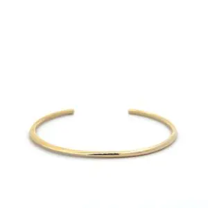 Minimal gold open cuff bracelet on white