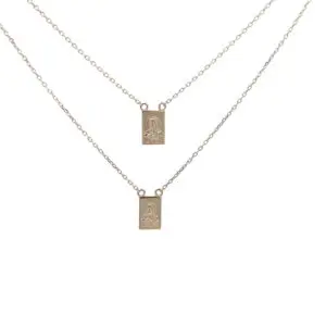 Layered gold rectangular pendant necklaces