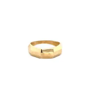 Faceted gold octagonal ring on white background