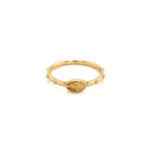 Gold oval medallion ring on white background