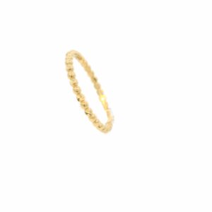 Delicate gold beaded ring on white