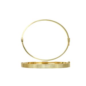 Pair of gold bangle bracelets on white