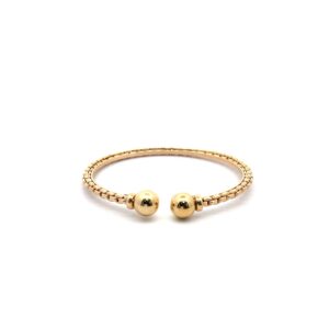 Gold cuff bracelet with ball ends