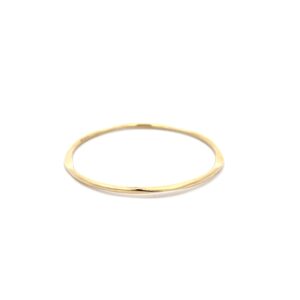Thin gold bangle bracelet on white background
