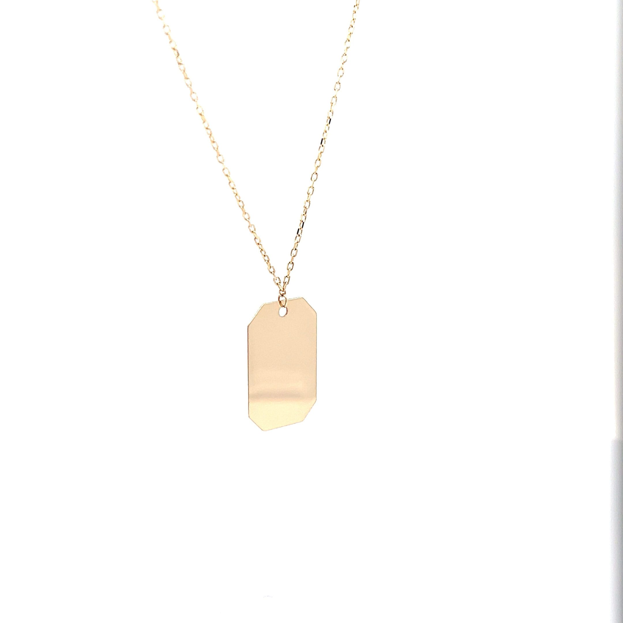 Gold dog tag pendant necklace on chain