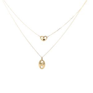 Layered gold necklaces with heart pendants
