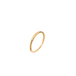 Delicate gold beaded ring on white background